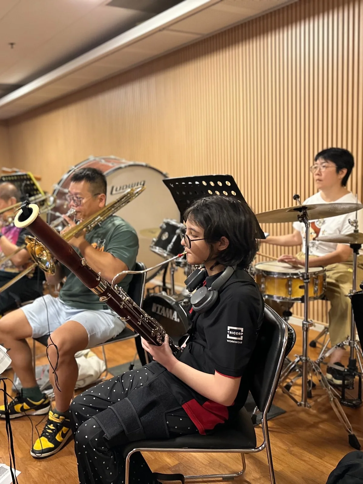 TWA learners playing bassoon, trombone and drums together in a Finale 2026 rehearsal