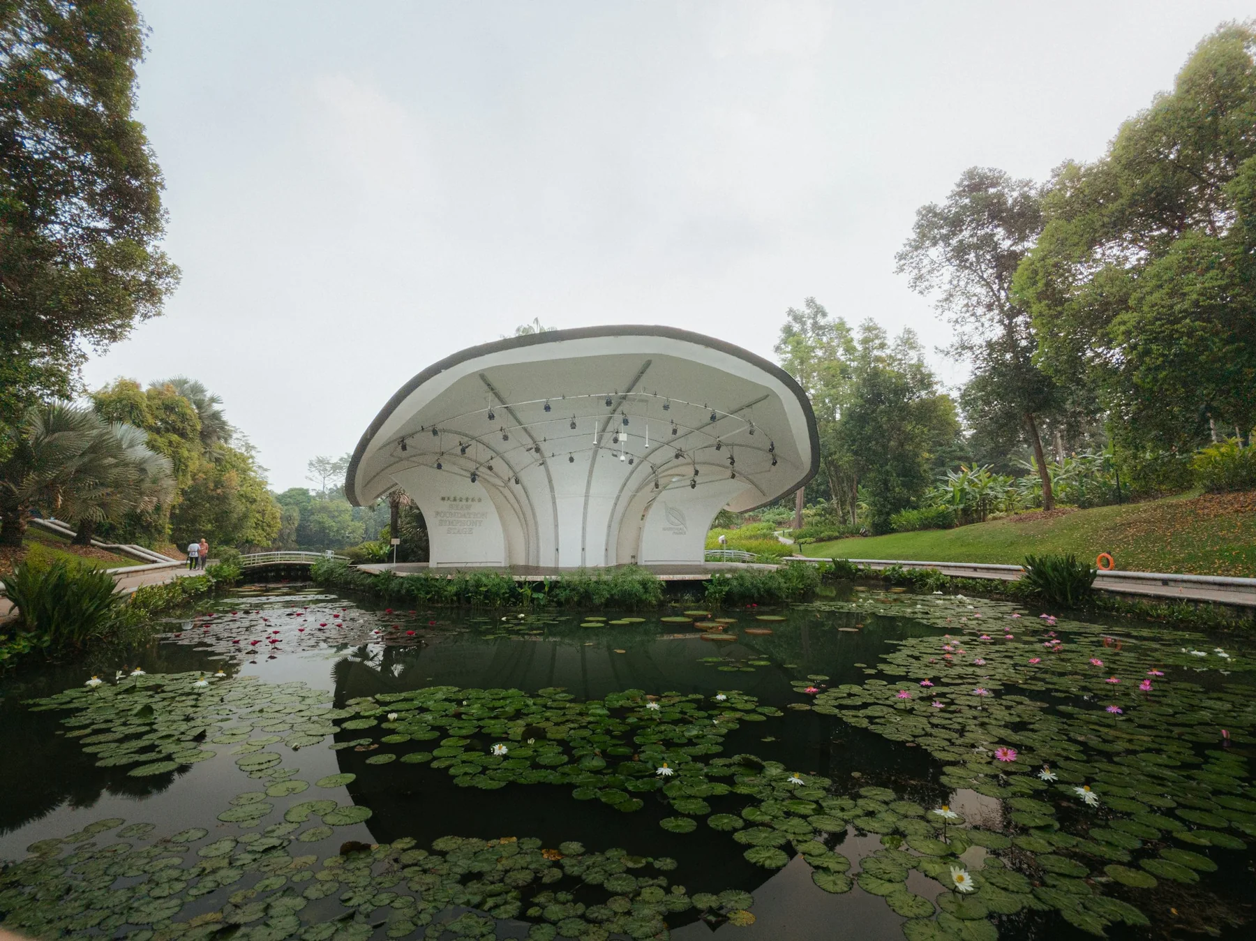 The Shaw Foundation Symphony Stage behind a pond of water lilies in the Singapore Botanic Gardens