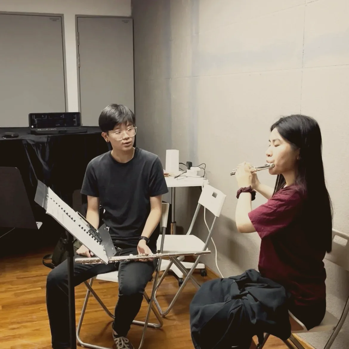 A TWA teacher guiding a flute learner in a one-to-one PSX lesson