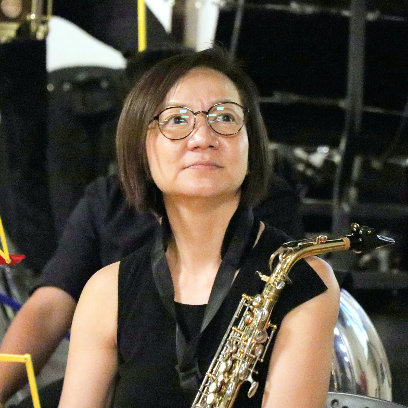 A TWA saxophonist waiting for her entry at a performance