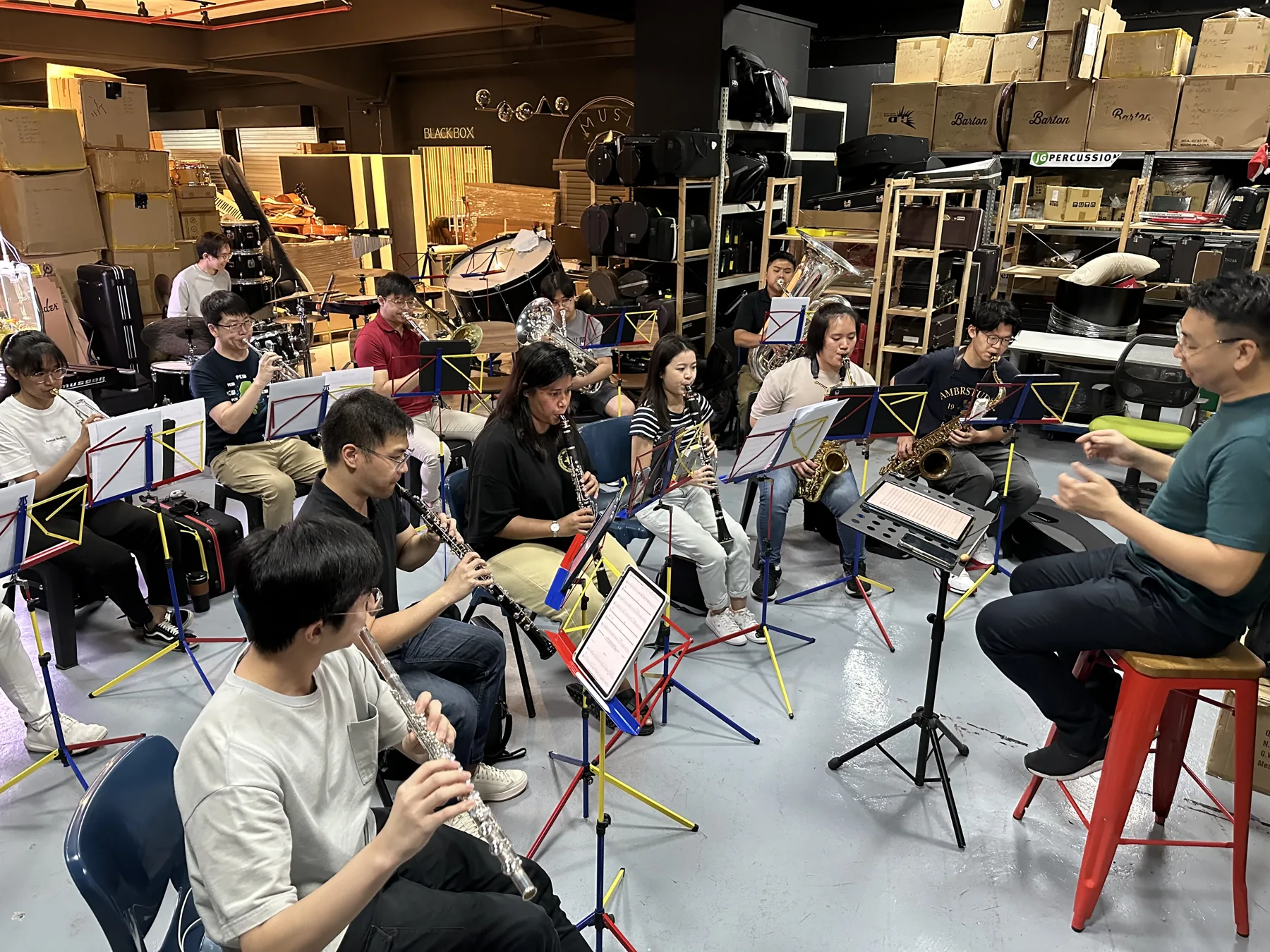 The TWA band rehearsing together in 2024, learners of every age with their instruments