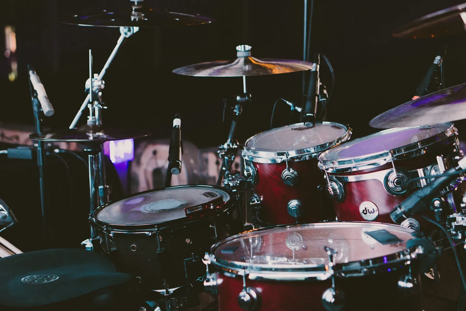 A red drum set with cymbals