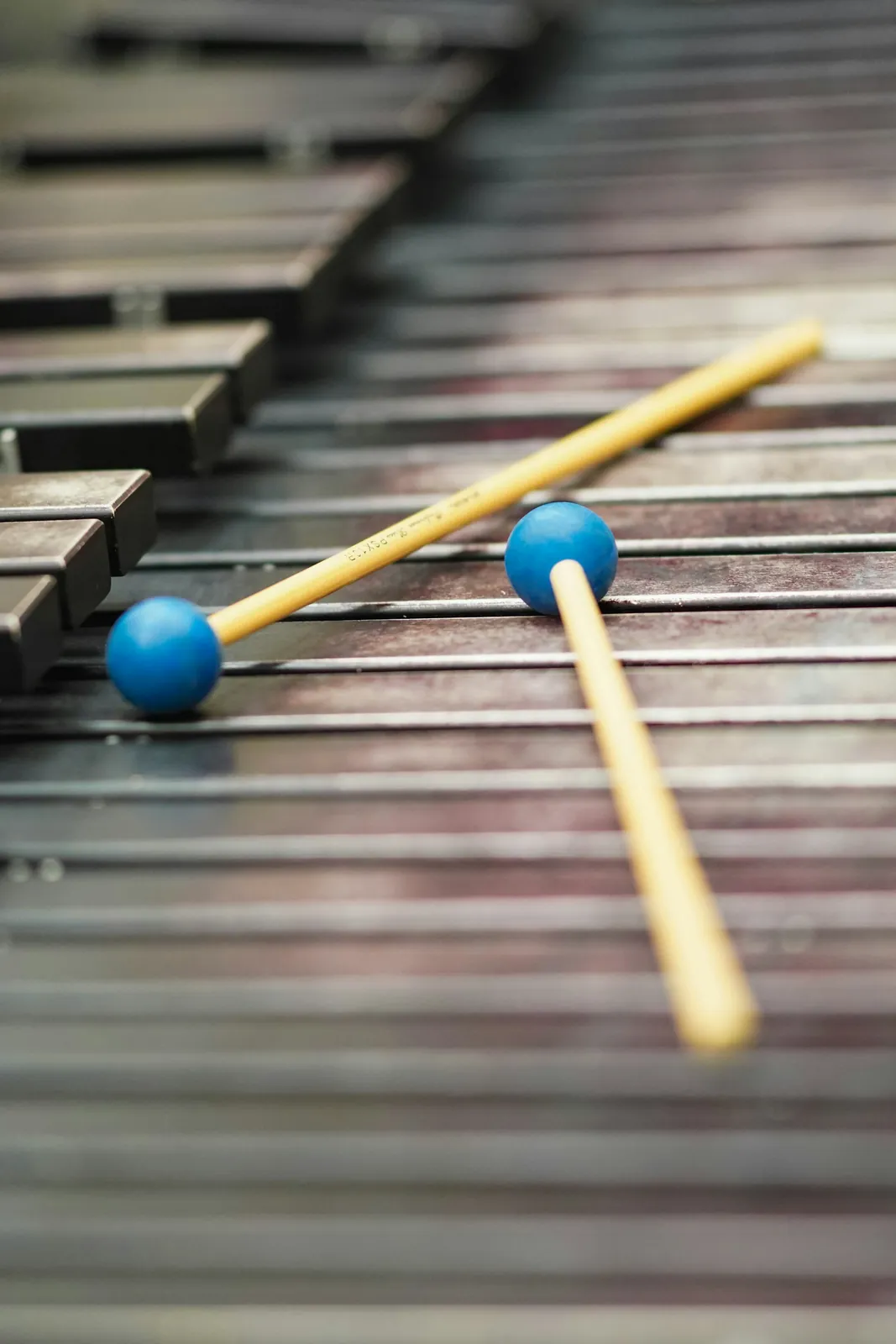 Two mallets resting on a vibraphone
