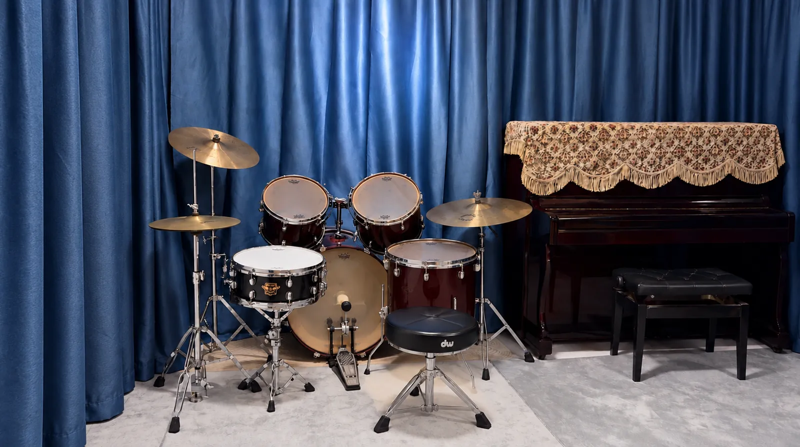 The drum kit and upright piano in the TWA studio
