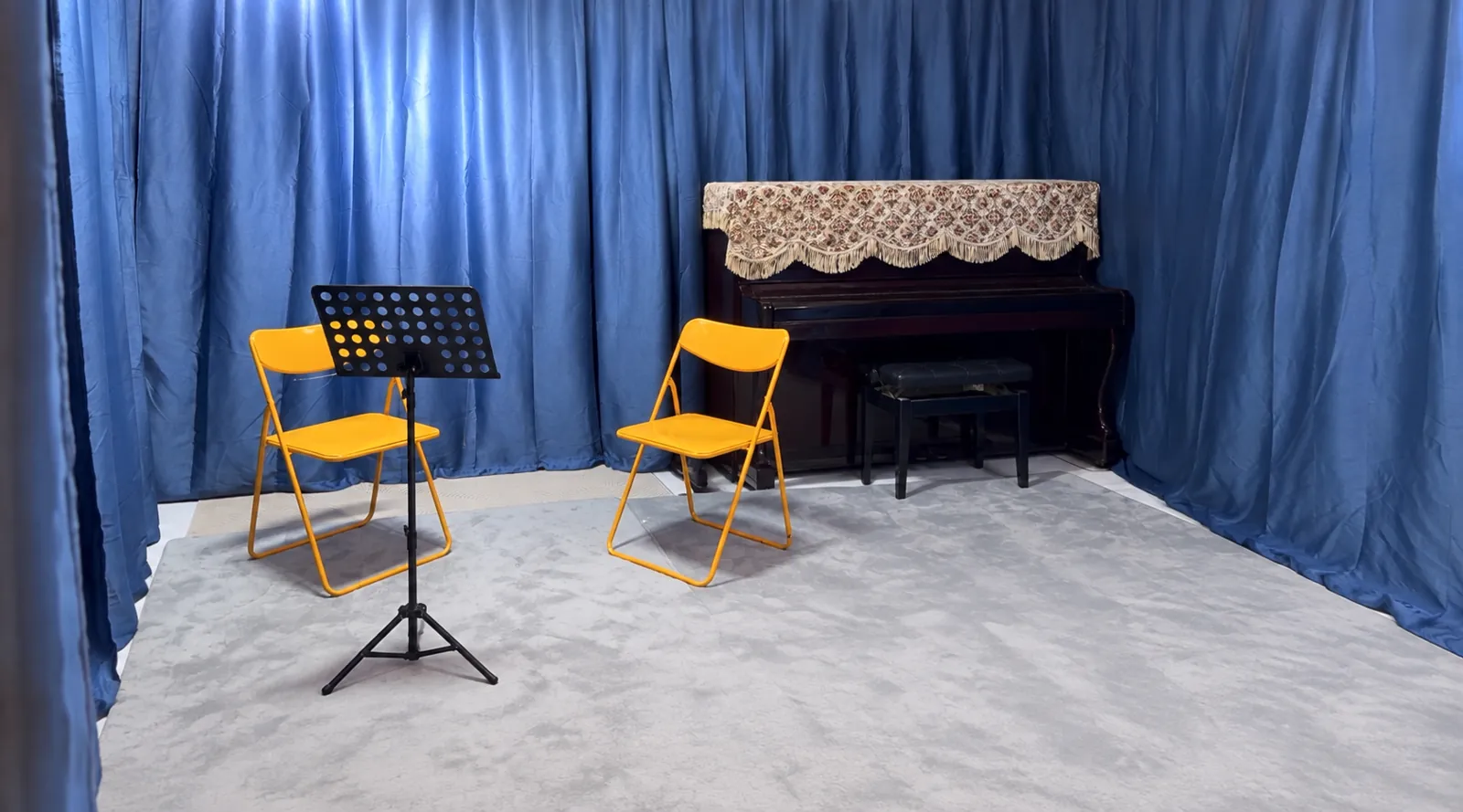 Two chairs and music stands set up for a one-to-one lesson in the TWA studio