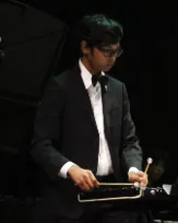 Akhilesh Vellavan performing on percussion