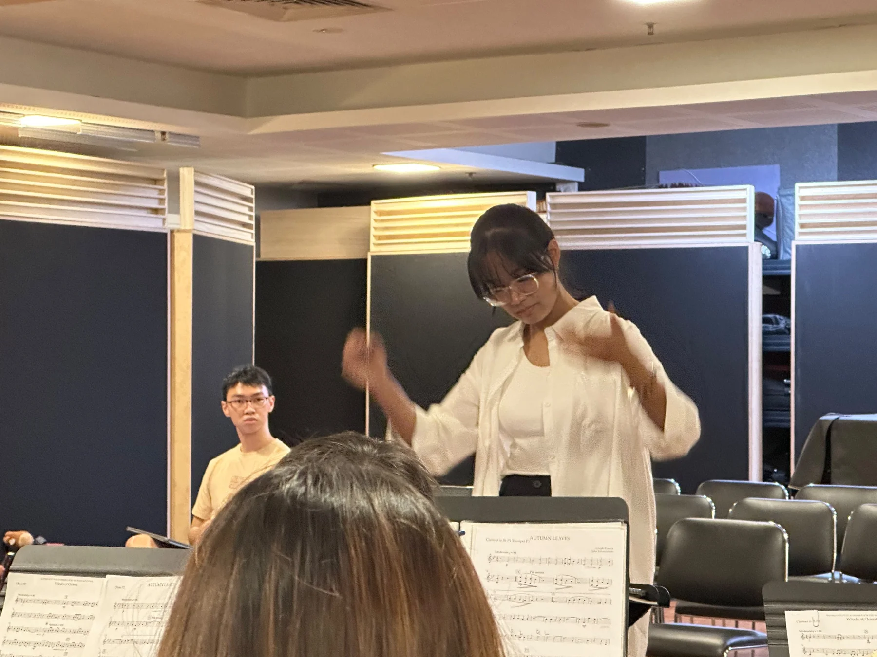 A TWA conductor leading a sectional rehearsal for Finale 2026