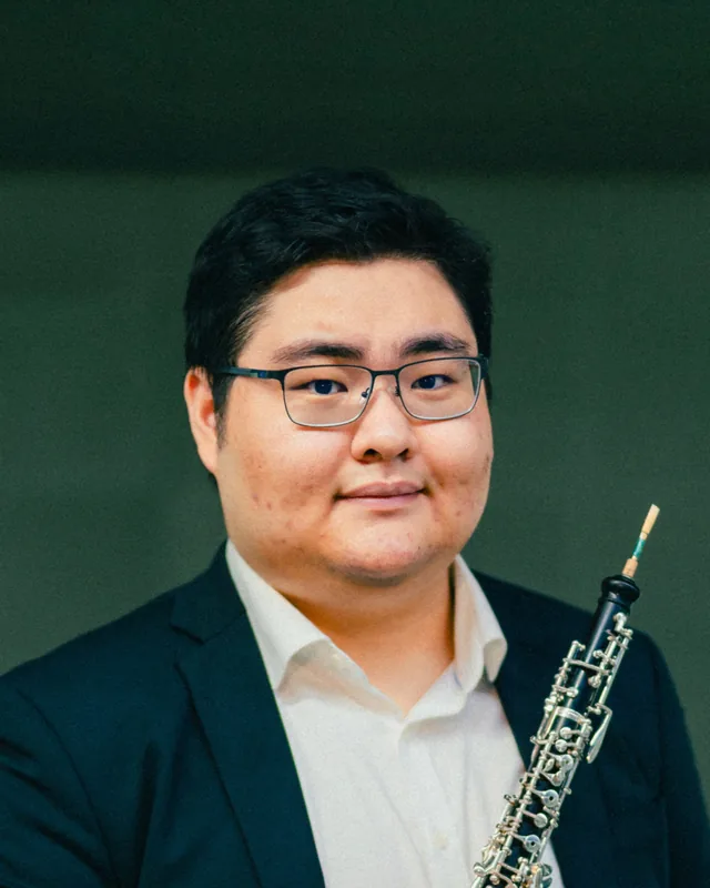 Huang Xing Yang holding his oboe