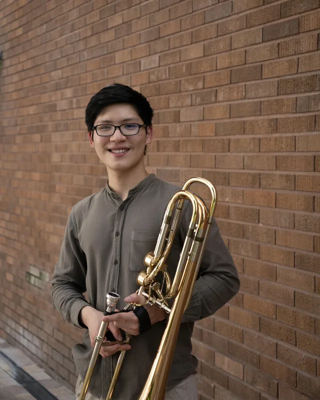 Ng Jun Jie holding his trombone