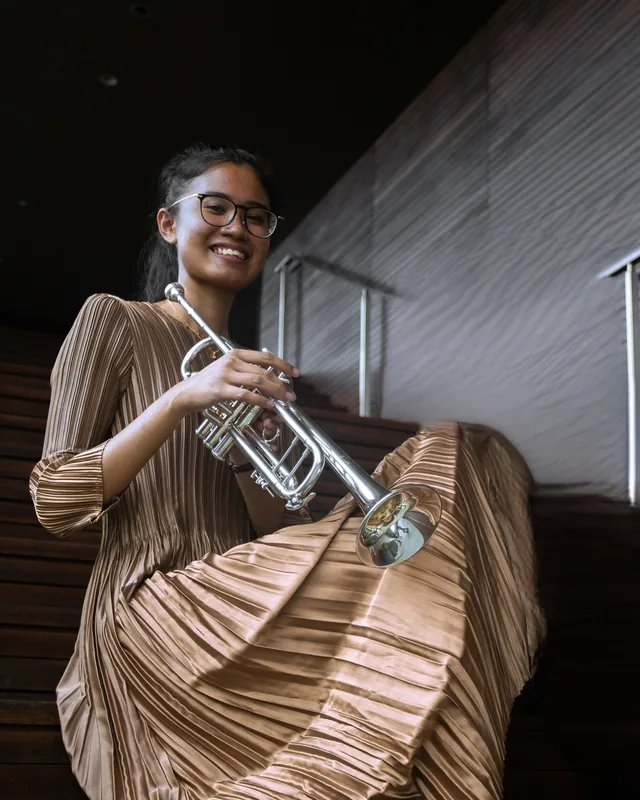 Nur Imaan holding her trumpet