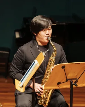 Ryan Wee playing the saxophone
